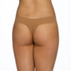 This is a model shown from the waist down (back view) of the Hanky Panky Bare Natural Rise Thong in taupe