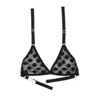 The Lena bralette by Hopeless Lingerie. It is a black mesh bra featuring large polka dots and is a classic triangle bralette with a halter strap.
