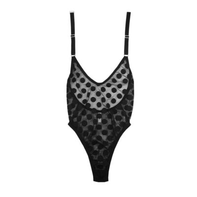 The Selma bodysuit by Hopeless Lingerie. This halter-style bodysuit is made of a sheer black mesh with a large allover polka dot print. The legs of the bodysuit are high cut.