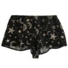 A flat lay of the Only Hearts Seeing Stars lounge shorts. The shorts are navy and feature a print of moons, stars and constellations printed in white and light pink. They are a loose fit but short inseam shorter than boxer shorts.