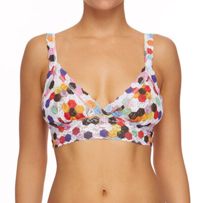 A model faces forward showing the front of the hanky panky honeycomb bralette, which pulls on over your head but has adjustable straps. The print is a multicolored honeycomb pattern on a stretch lace.