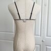 back view of only hearts coucou lola two-toned brigitte body teddy in cream with black trim (on a dress form)