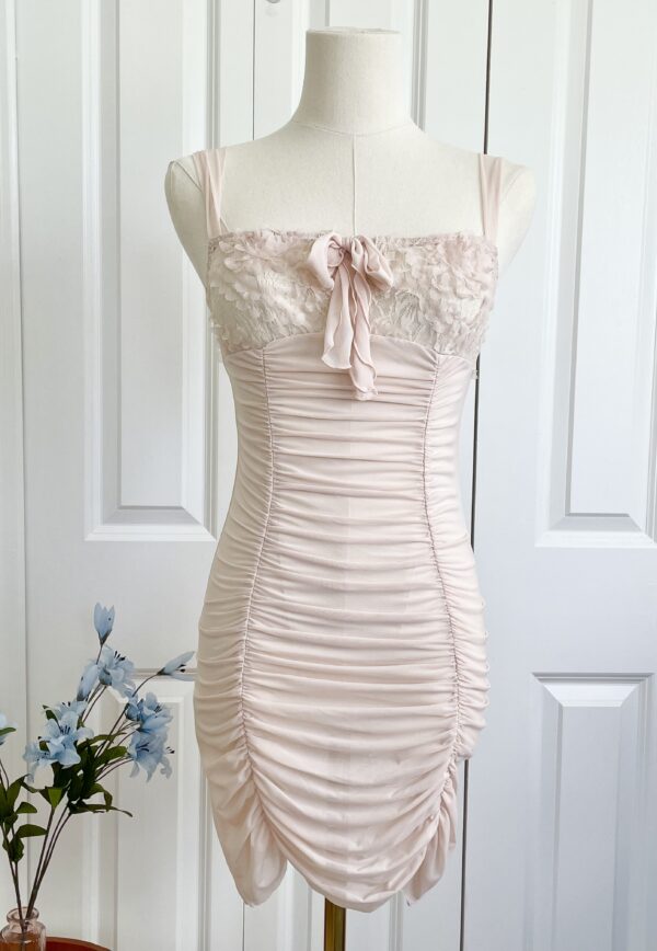 mannequin featuring the only hearts simone ruched boudoir slip in blush pink mesh