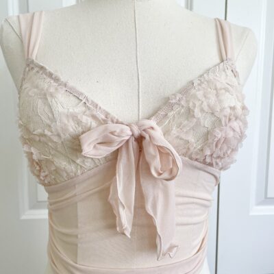 the simone ribbon cami (pictured on a mannequin) in blush pink mesh