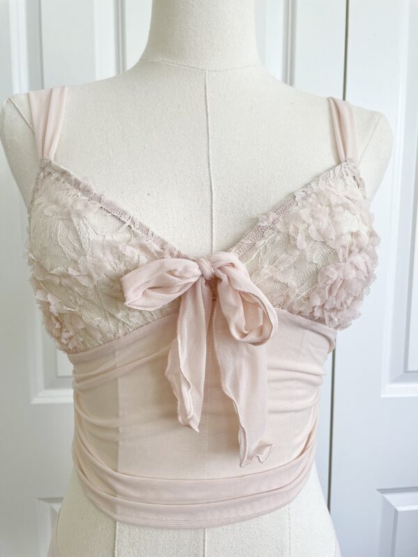 the simone ribbon cami (pictured on a mannequin) in blush pink mesh