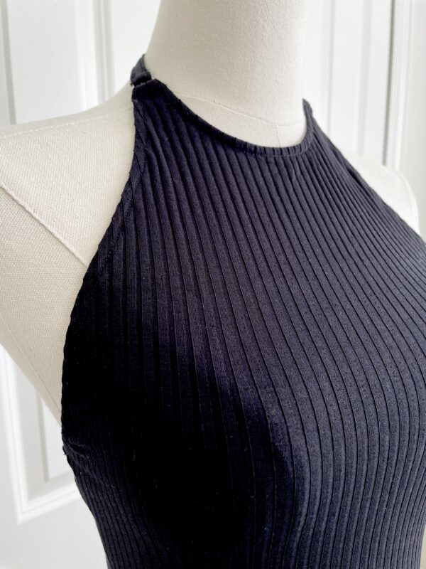 close up view of the bust area and neckline of the only hearts eco rib bodysuit in black (on a mannequin)