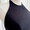 close up view of the bust area and neckline of the only hearts eco rib bodysuit in black (on a mannequin)
