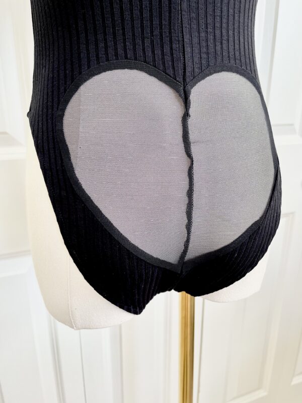 back view of the only hearts eco rib bodysuit in black (on a mannequin)