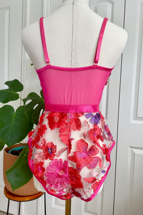 back view (on mannequin) of the kilo brava bright 3d floral teddy