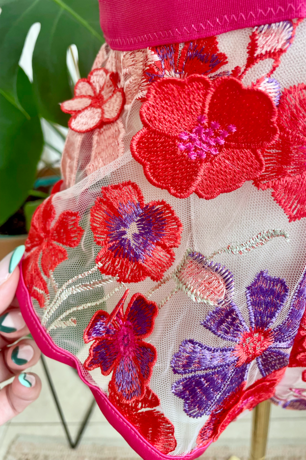 close up view (on mannequin) of the kilo brava bright 3d floral teddy
