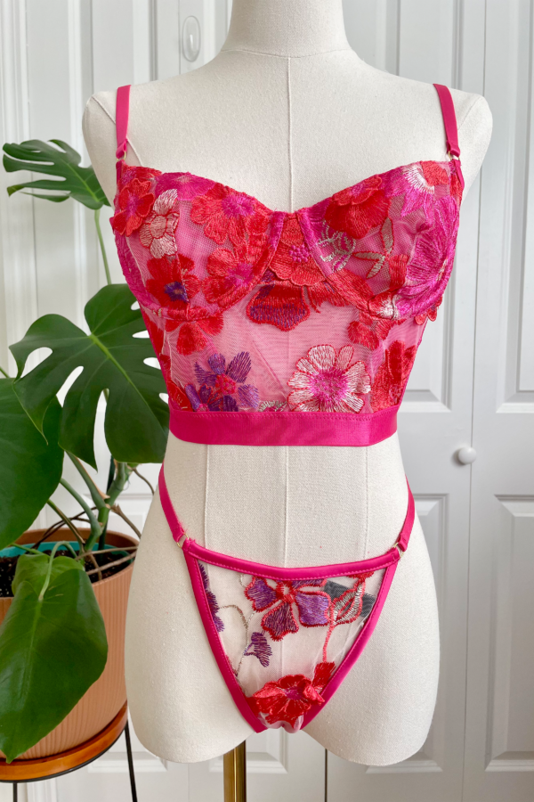 mannequin posed with the kilo brava bright 3D floral embroidered underwire bustier and g-string thong