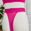 close up image of back view of kilo brava azalea pink stretch lace high leg thong