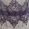 close up of lace of the only hearts halter so fine lace bodysuit teddy in purple.