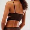 back view of a model who wears the Only Hearts Whisper Stacked black bodysuit