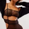 model wears the only hearts whisper stacked mesh bodysuit in black