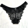 flatlay image of the back of the Only Hearts So fine lace g-string thong panties in black lace. the underwear lay on a white cloth background