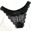 flatlay image of the Only Hearts So fine lace g-string thong panties in black lace. the underwear lay on a white cloth background