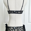 back view of the only hearts isabel embroidered black lace bralette and bikini brief