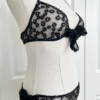 side view of the only hearts isabel embroidered black lace bralette and bikini brief