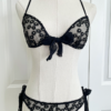 front view of the only hearts isabel embroidered black lace bralette and bikini brief