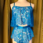 mannequin wearing the kilo brava crop cami + tap shorts in Hawaiian Blue eyelash lace