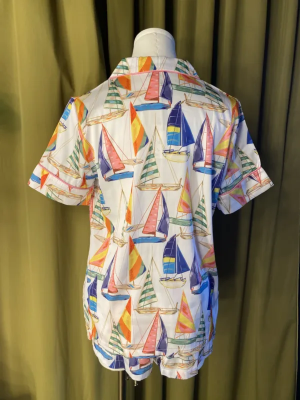 Satin Shortie PJ Set in Sail Away displayed on a mannequin, featuring vintage sailboat print, pink piping, and silky simulated silk fabric.
