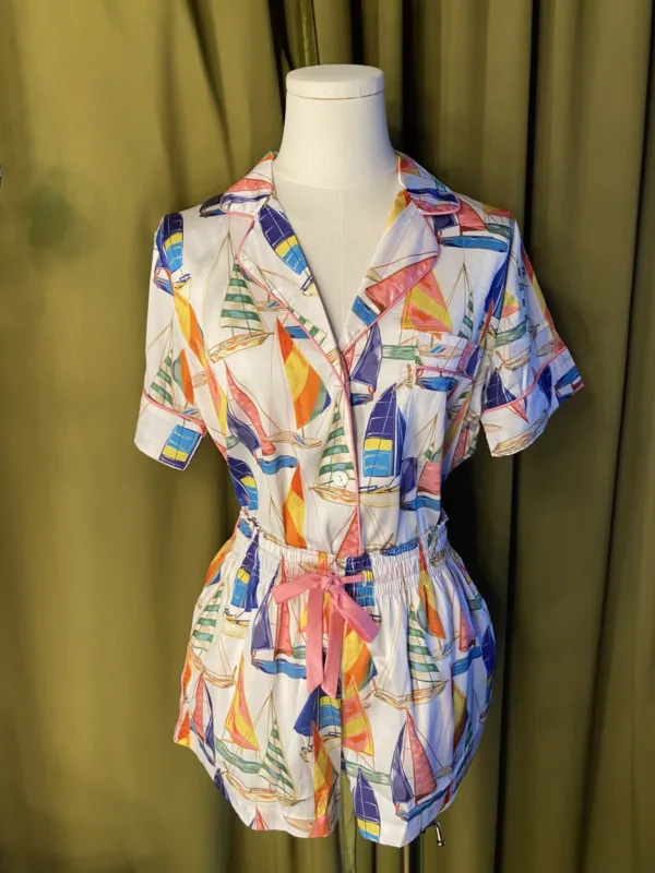 Satin Shortie PJ Set in Sail Away displayed on a mannequin, featuring vintage sailboat print, pink piping, and silky simulated silk fabric.
