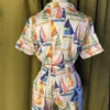 Satin Shortie PJ Set in Sail Away displayed on a mannequin, featuring vintage sailboat print, pink piping, and silky simulated silk fabric.