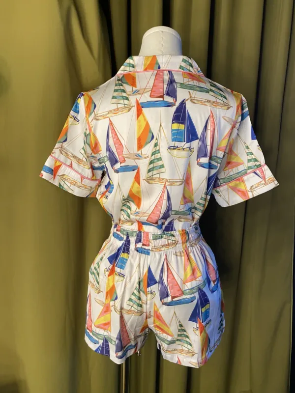 Satin Shortie PJ Set in Sail Away displayed on a mannequin, featuring vintage sailboat print, pink piping, and silky simulated silk fabric.