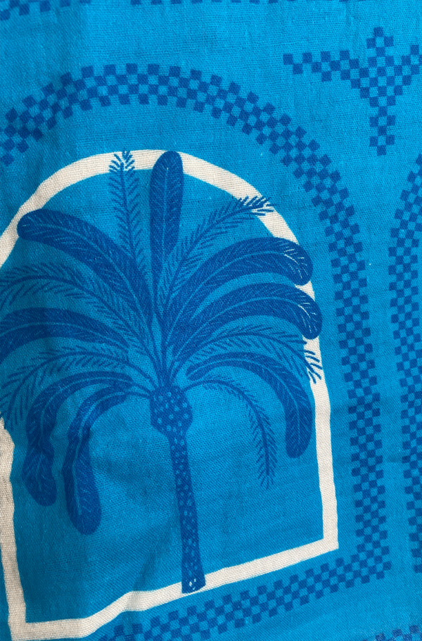 close up of kilo brava cotton pj set in resort palms print